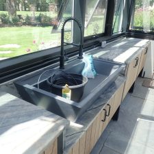 Custom greenhouse cabinetry with large wash basin sink, how to frame a greenhouse,